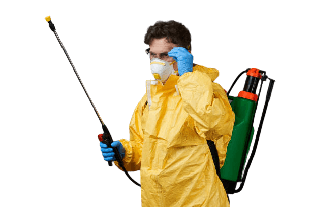 Pest control technician in a yellow hazmat suit and respirator holding a spray wand